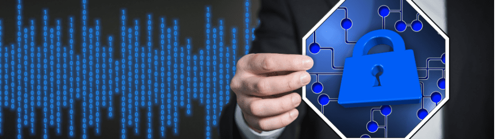 Hand holding lock image in front of computer code screen